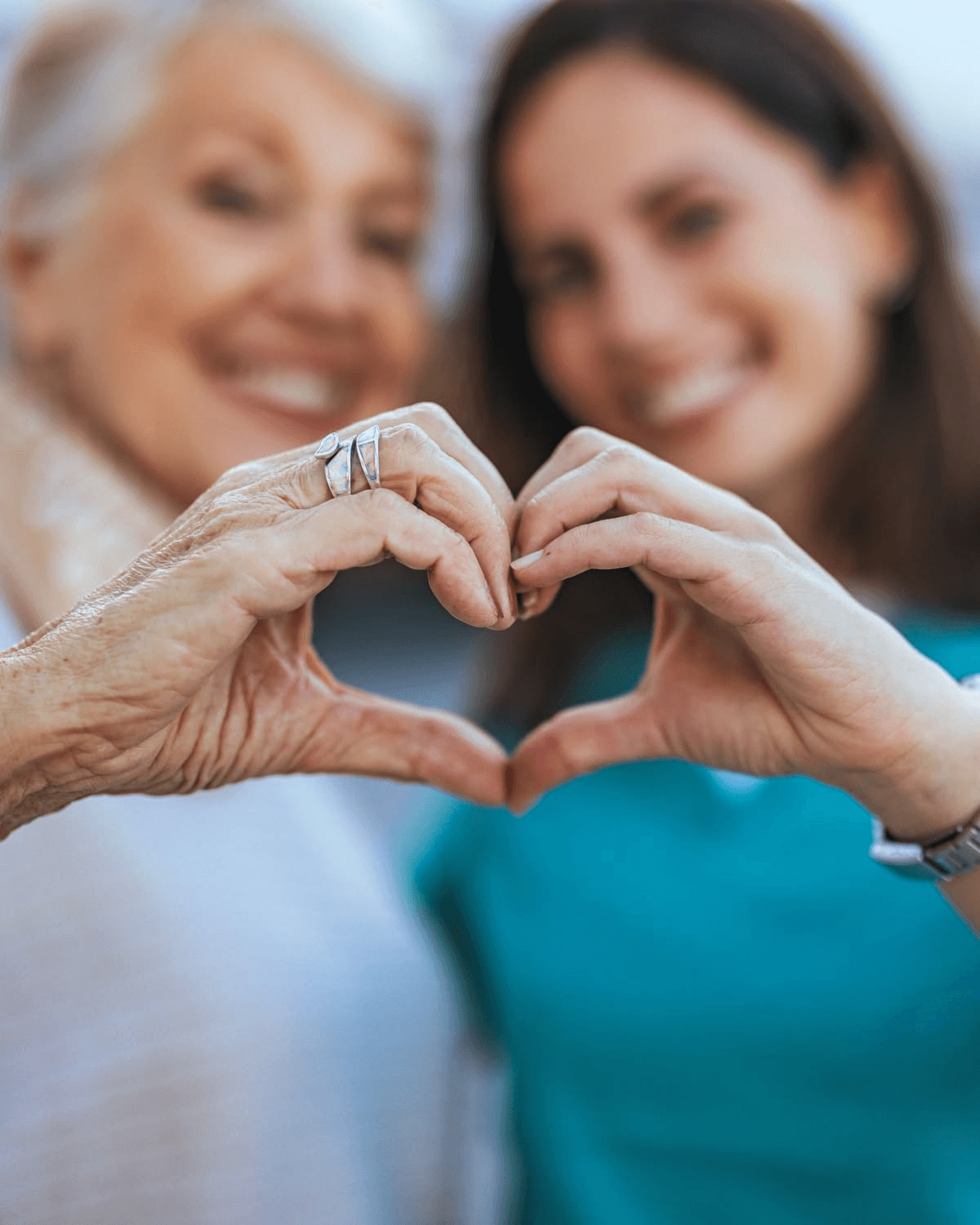 Hands held together, care in the home
